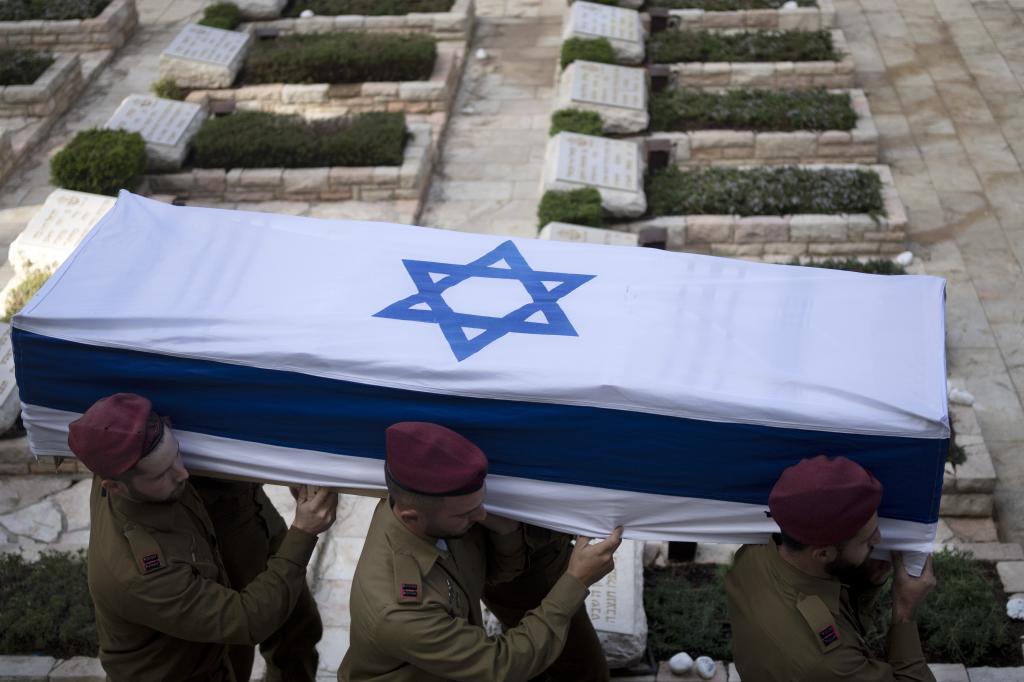 Soldiers carry the coffin of Israeli Army Capt. Eitan Yitzhak Oster, who was killed in action in Lebano
