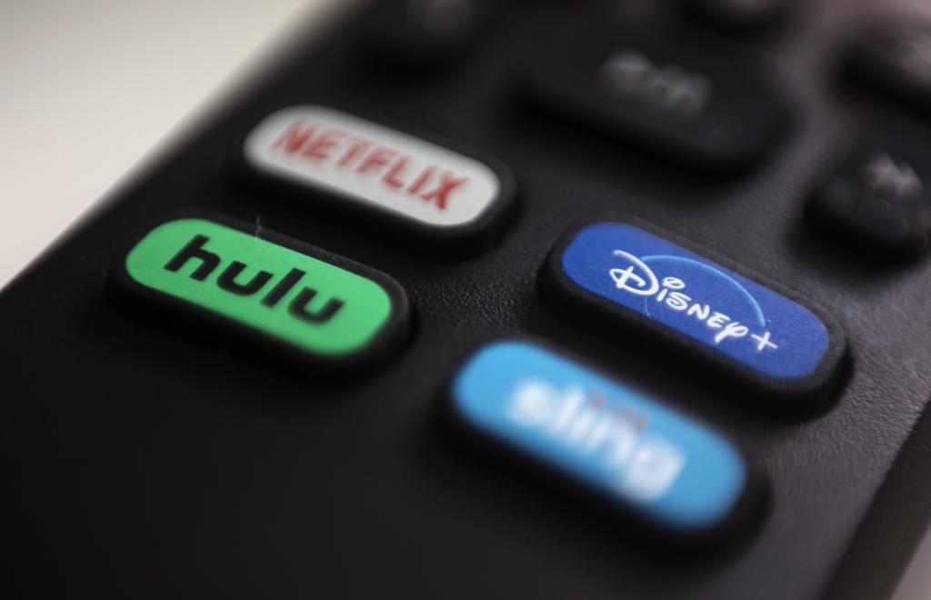 he logos for streaming services Netflix, Hulu, Disney Plus and Sling TV