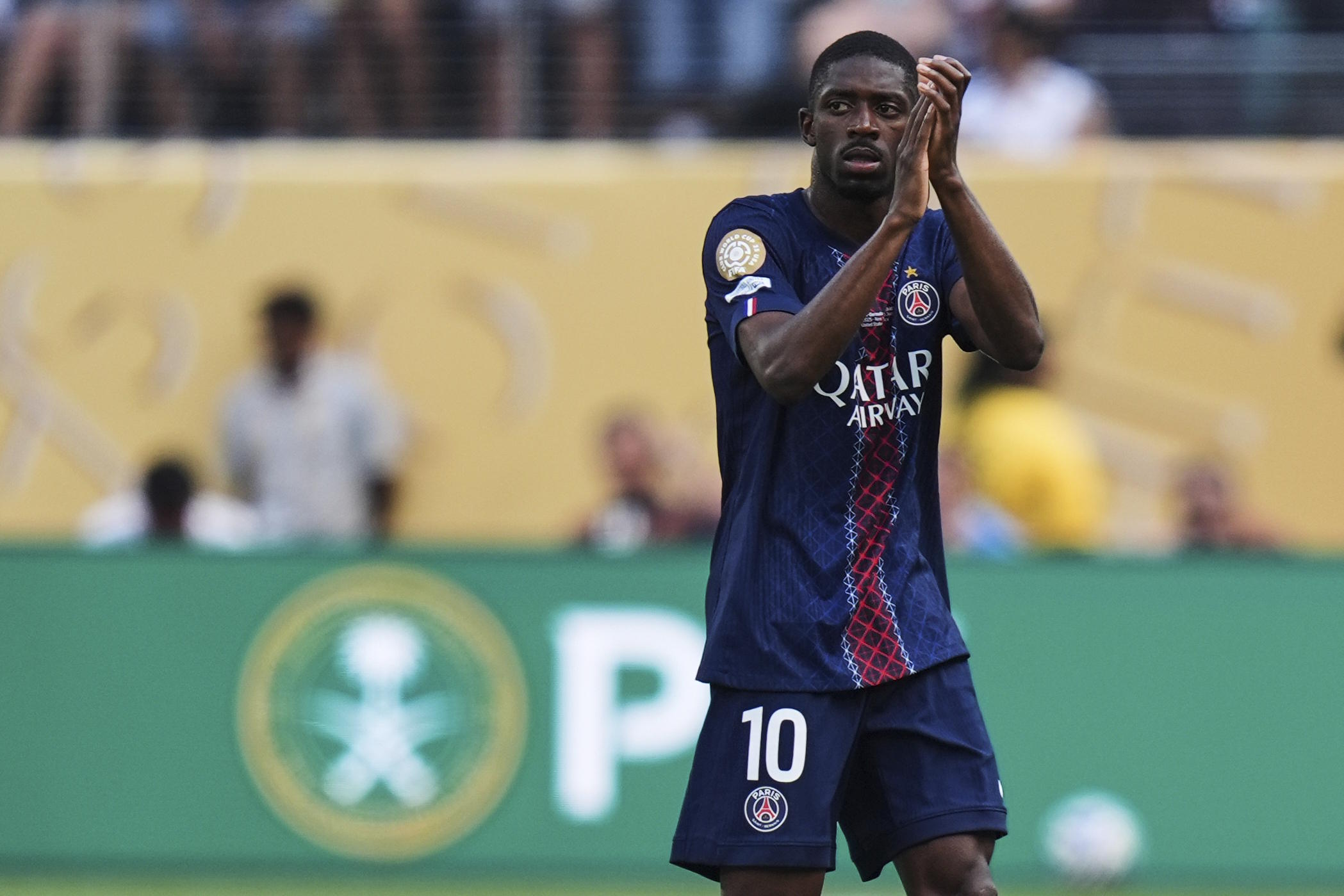Dembele applauds fans as he comes out during the Club World Cup semifinal.