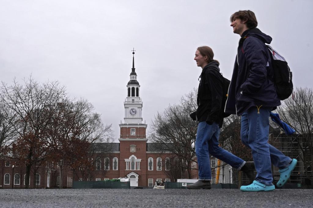A group of students crosses the campus of Dartmouth College.