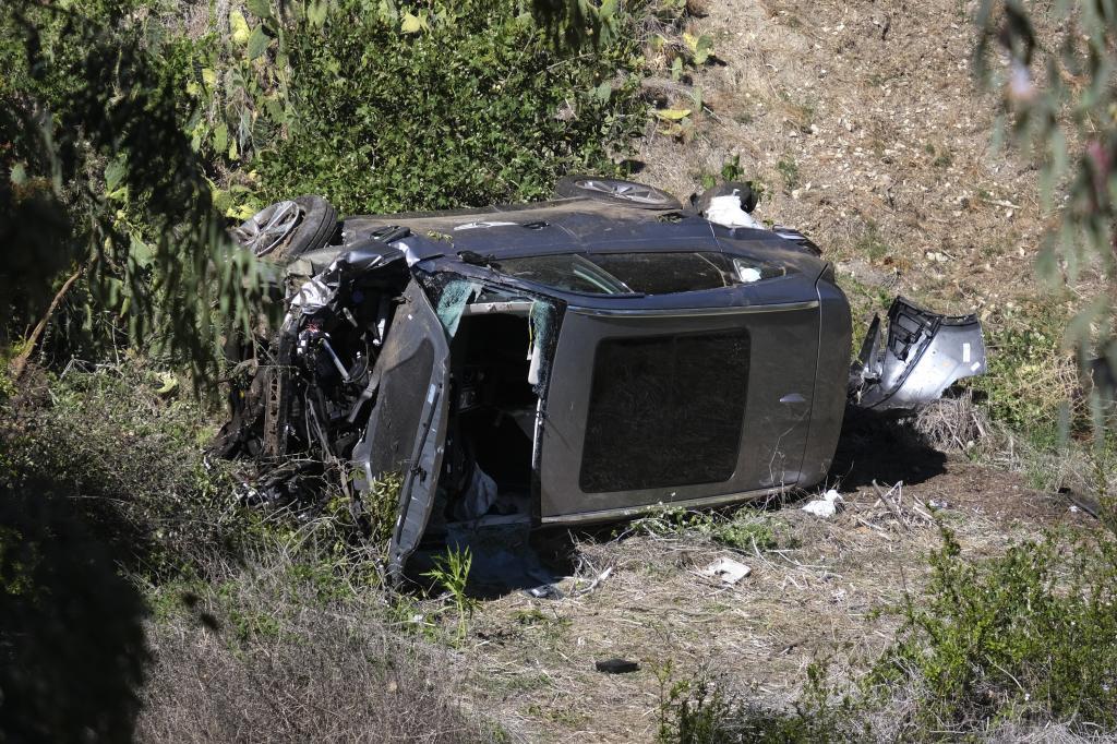 A vehicle rests on its side after a rollover accident.