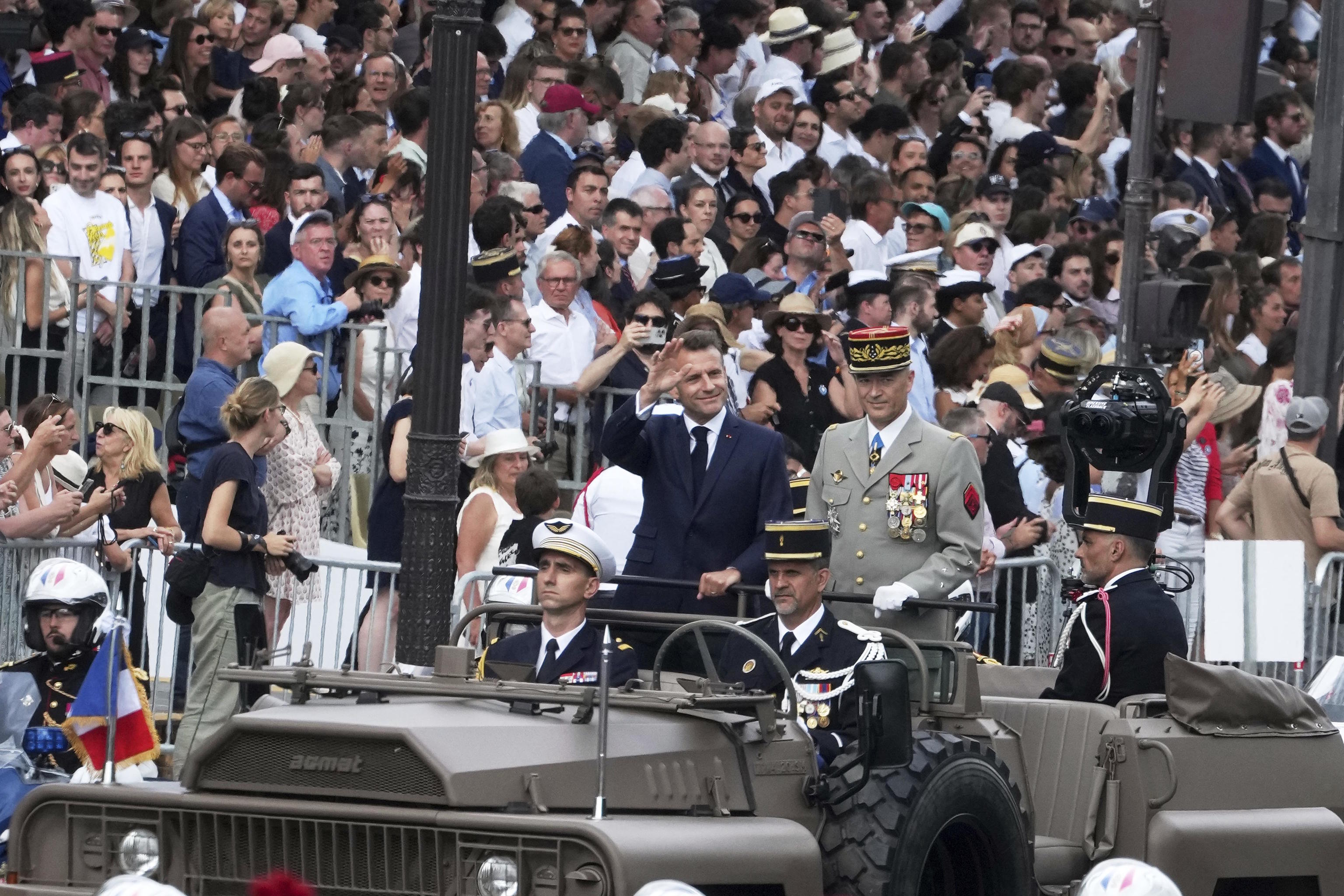 Macron in the command car during the military parade for Bastille Day.