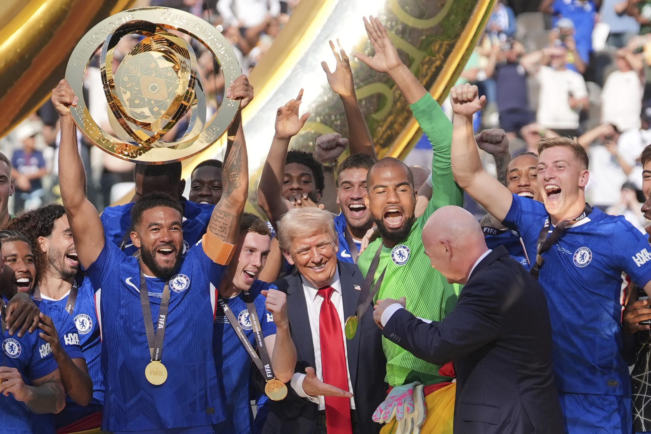 President  Trump reaches out to shake hands with FIFA President Infantino.