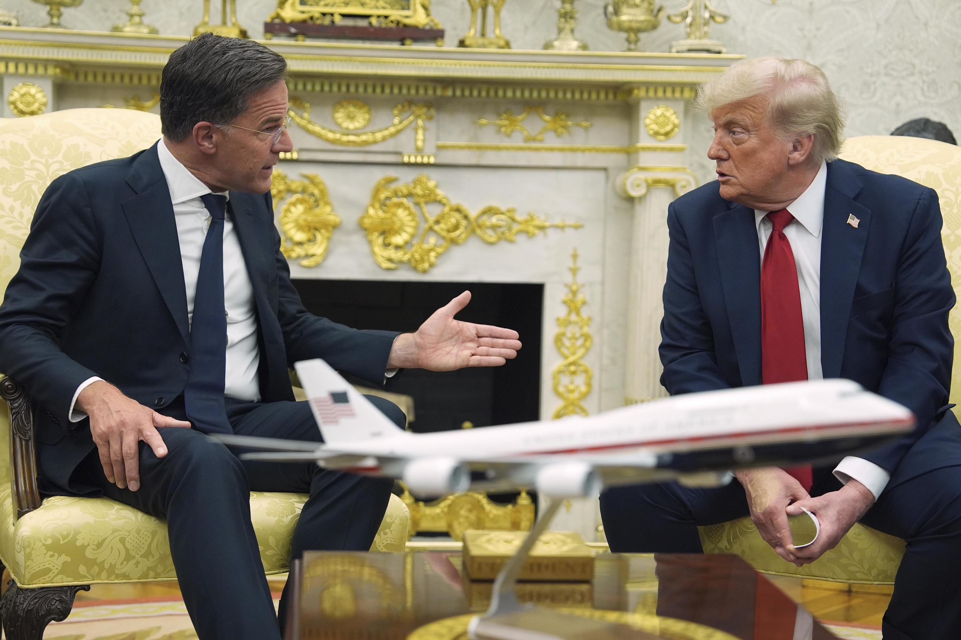 NATO Secretary General Mark Rutte speaks with President Donald Trump.