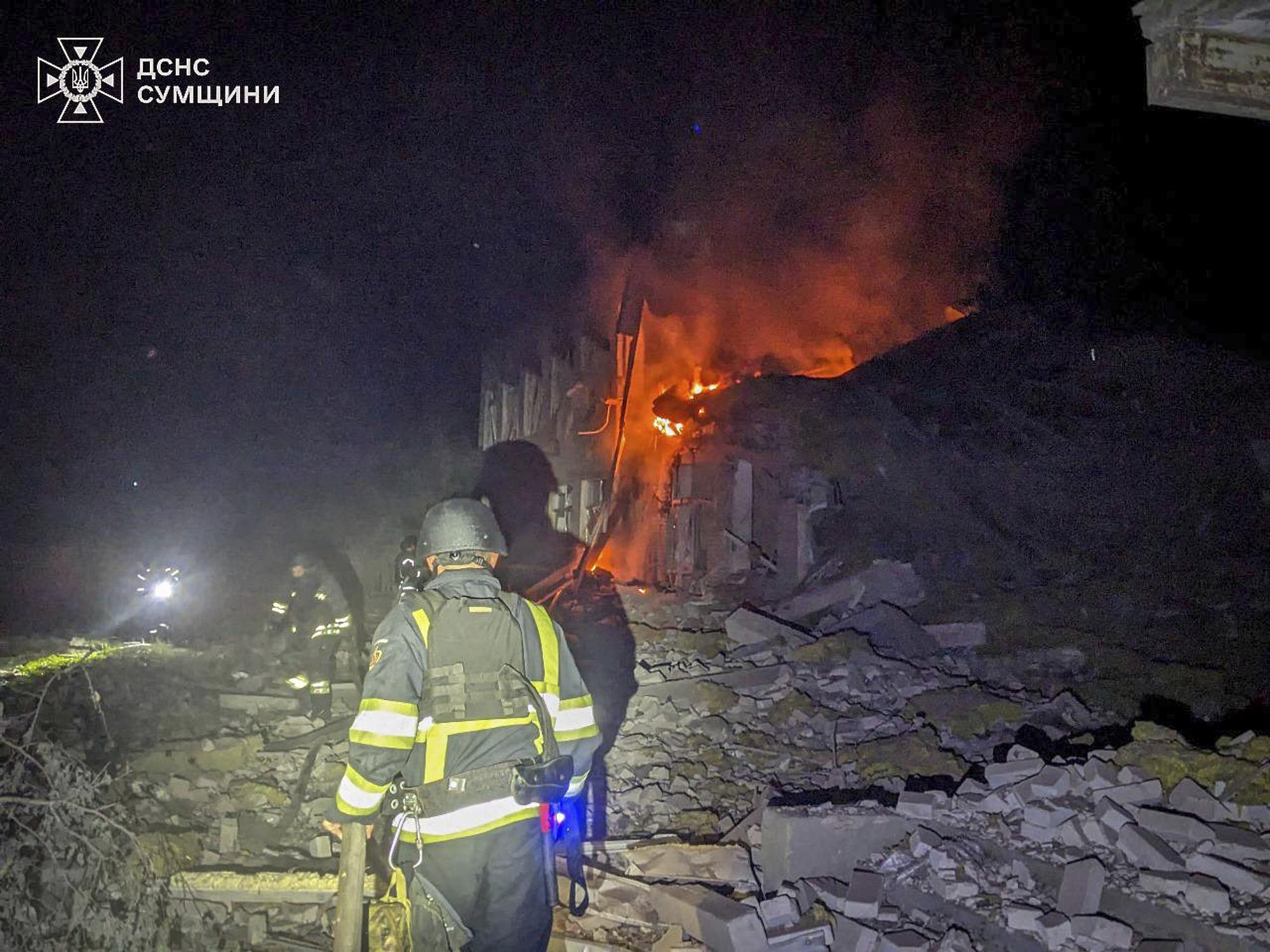 firefighters put out the fire of a hospital following a Russian attack in Sumy region.