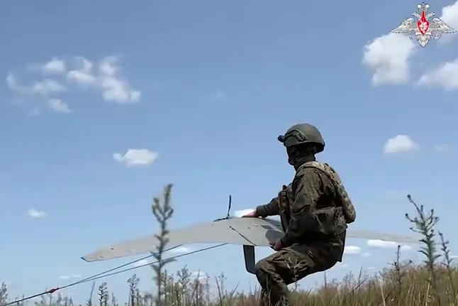 A Russian military operates a "Supercam" drone in Ukraine.