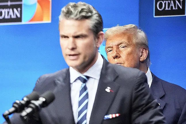 Donald Trump observes Pete Hegseth during the NATO summit last June.