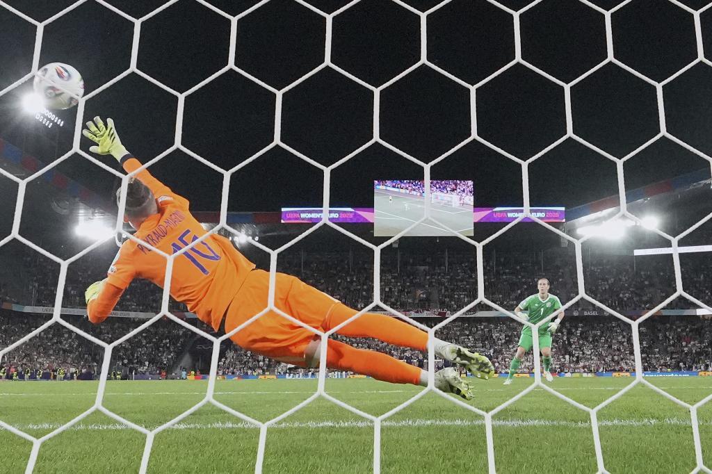 Germany goalkeeper Ann-Katrin Berger scores a penalty against France.