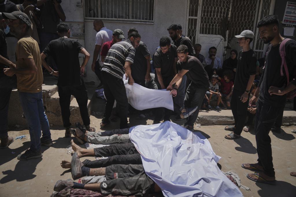 The bodies of Palestinians killed while trying to reach aid.