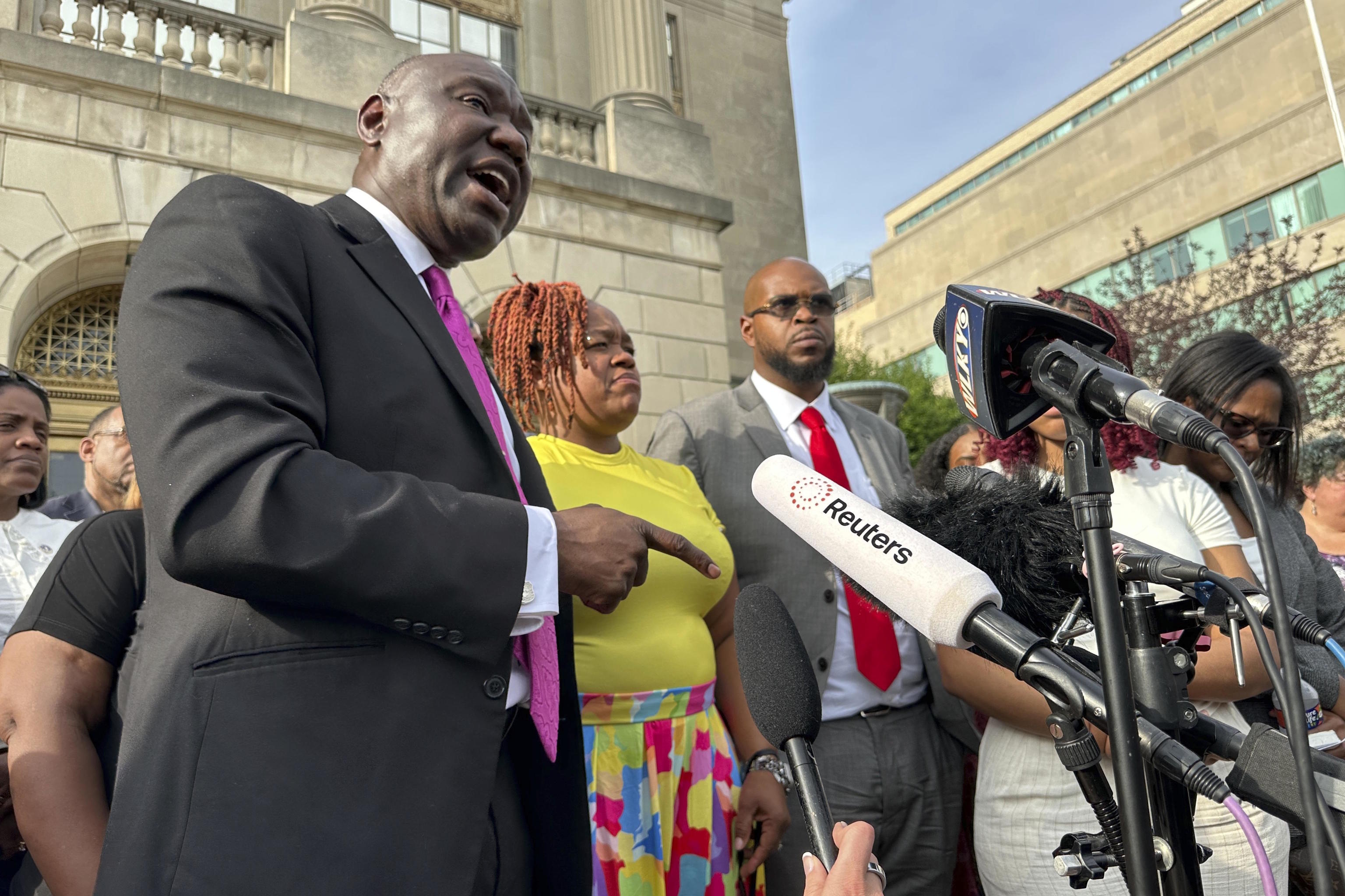 Attorney Ben Crump, left, stands beside T.Palmer, mother of Breonna Taylor.
