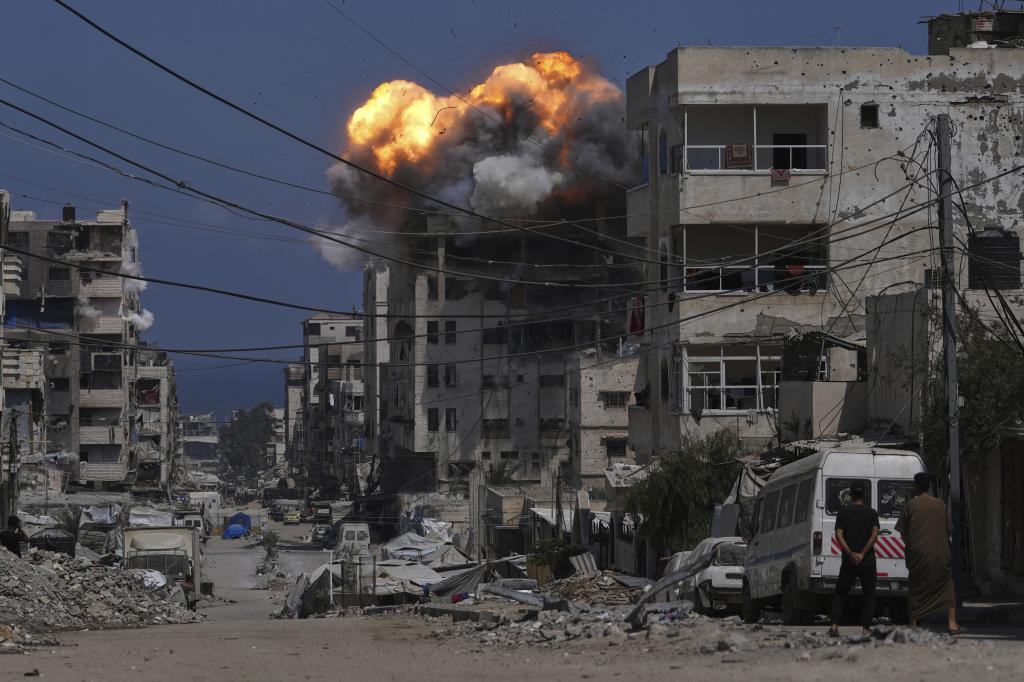 Smoke and flames erupt from an Israeli airstrike in Gaza City.