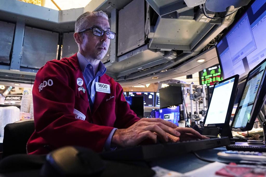 Trader John Gorman works on the floor of the New York Stock.