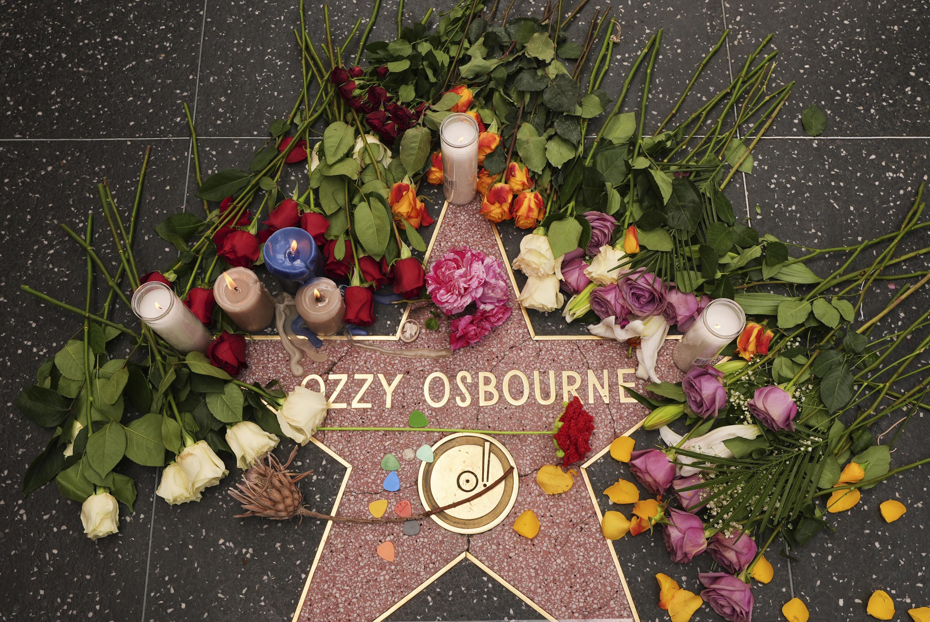 Flowers lie around the star for Ozzy Osbourne at the Hollywood Walk of Fame.