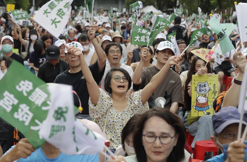 People react as votes are counted after an election.