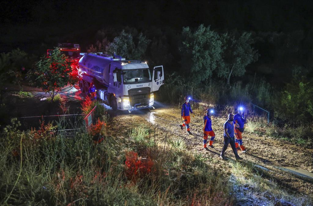 Firefighters work to extinguish a wildfire in Bursa, Turkey.