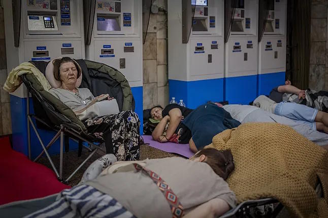 Kyiv residents take shelter in a metro station during an air attack alert in Kyiv.