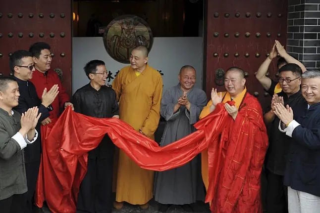 Shi Yongxin, abbot of the Shaolin Temple, wearing a red and yellow robe.