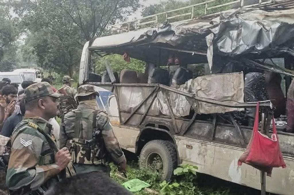 Soldiers inspect the wreckage of a bus that was carrying Hindu pilgrims.