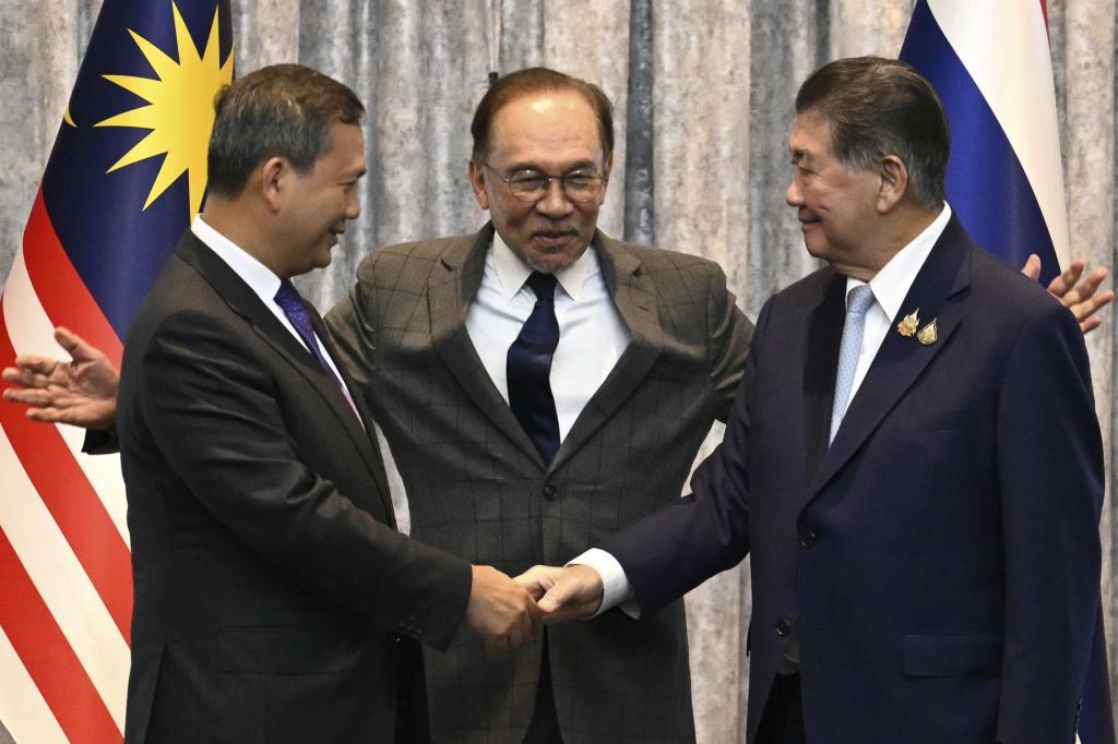 Cambodia's Prime Minister , left and Thailand's Prime Minister.