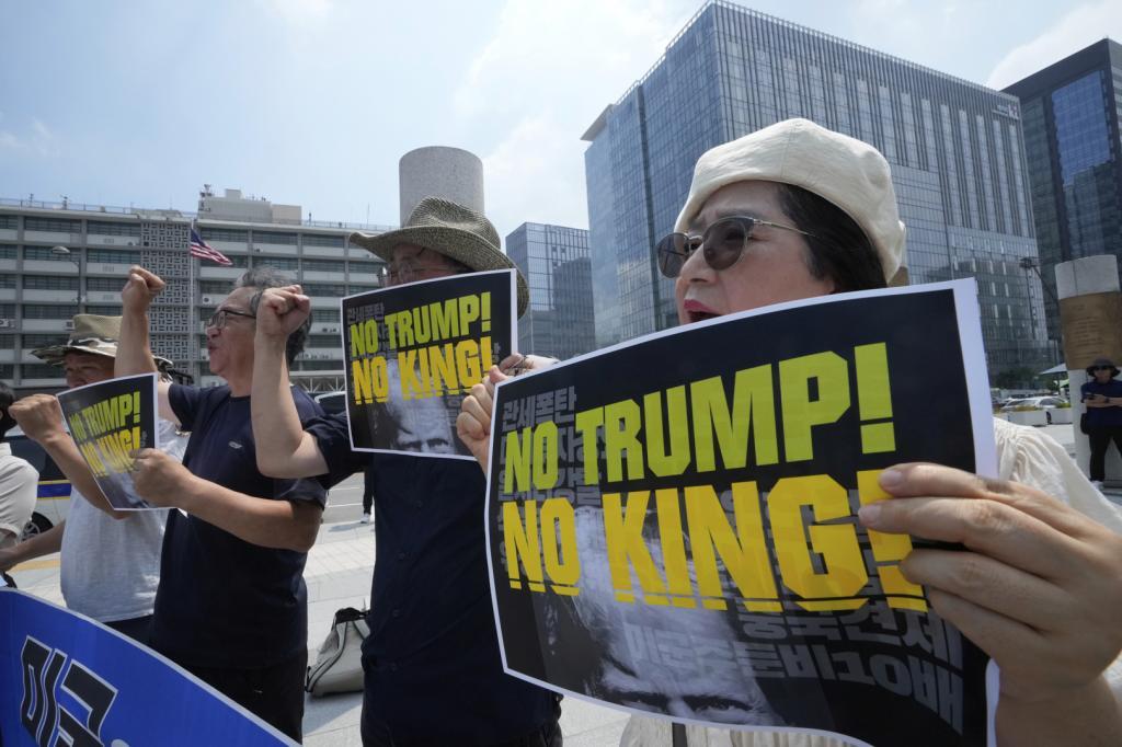 Members of civic groups protest against U.S. President.