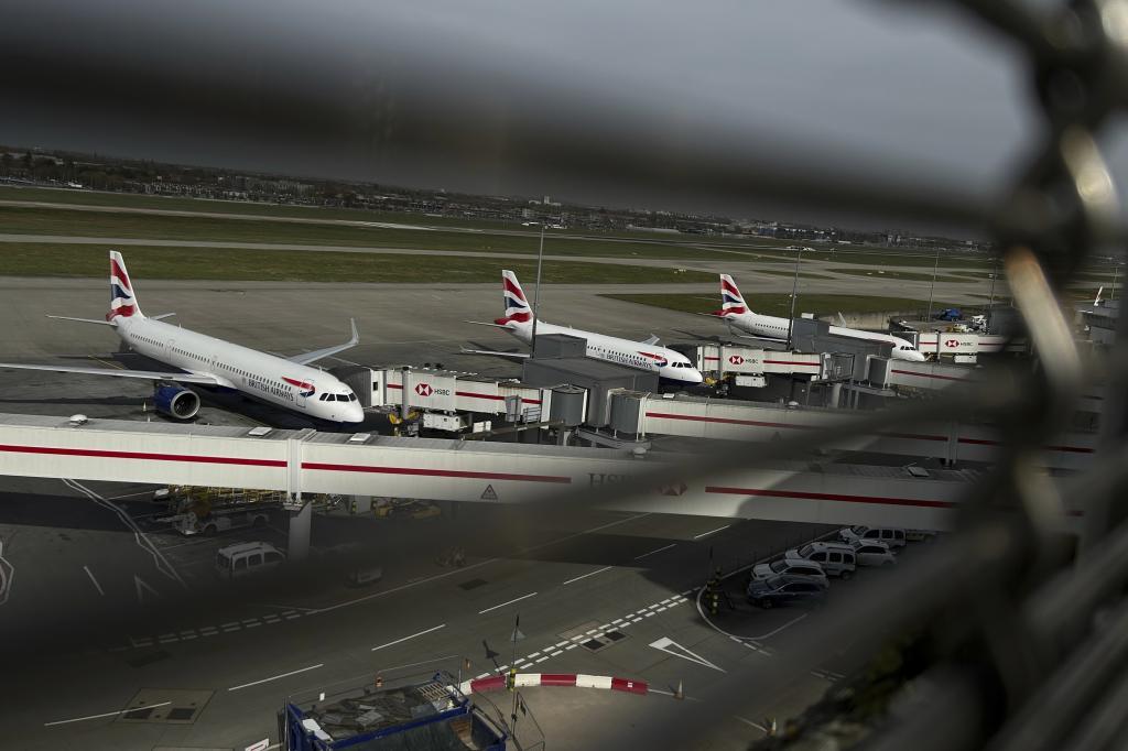 Planes are parked at Terminal 5 at Heathrow Airport in London.