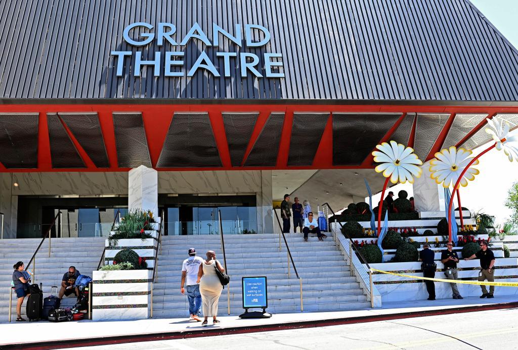 Police stand on the right of an entrance to the Grand Sierra Resort.