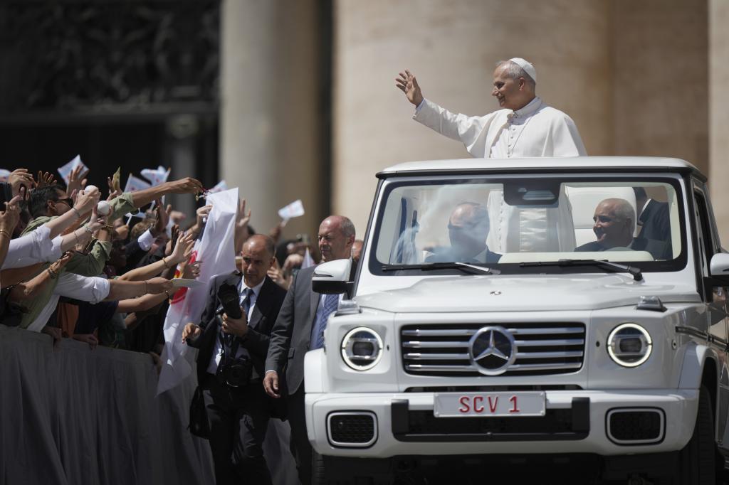 Pope Leo XIV waves faithful at the end of his weekly general audience.