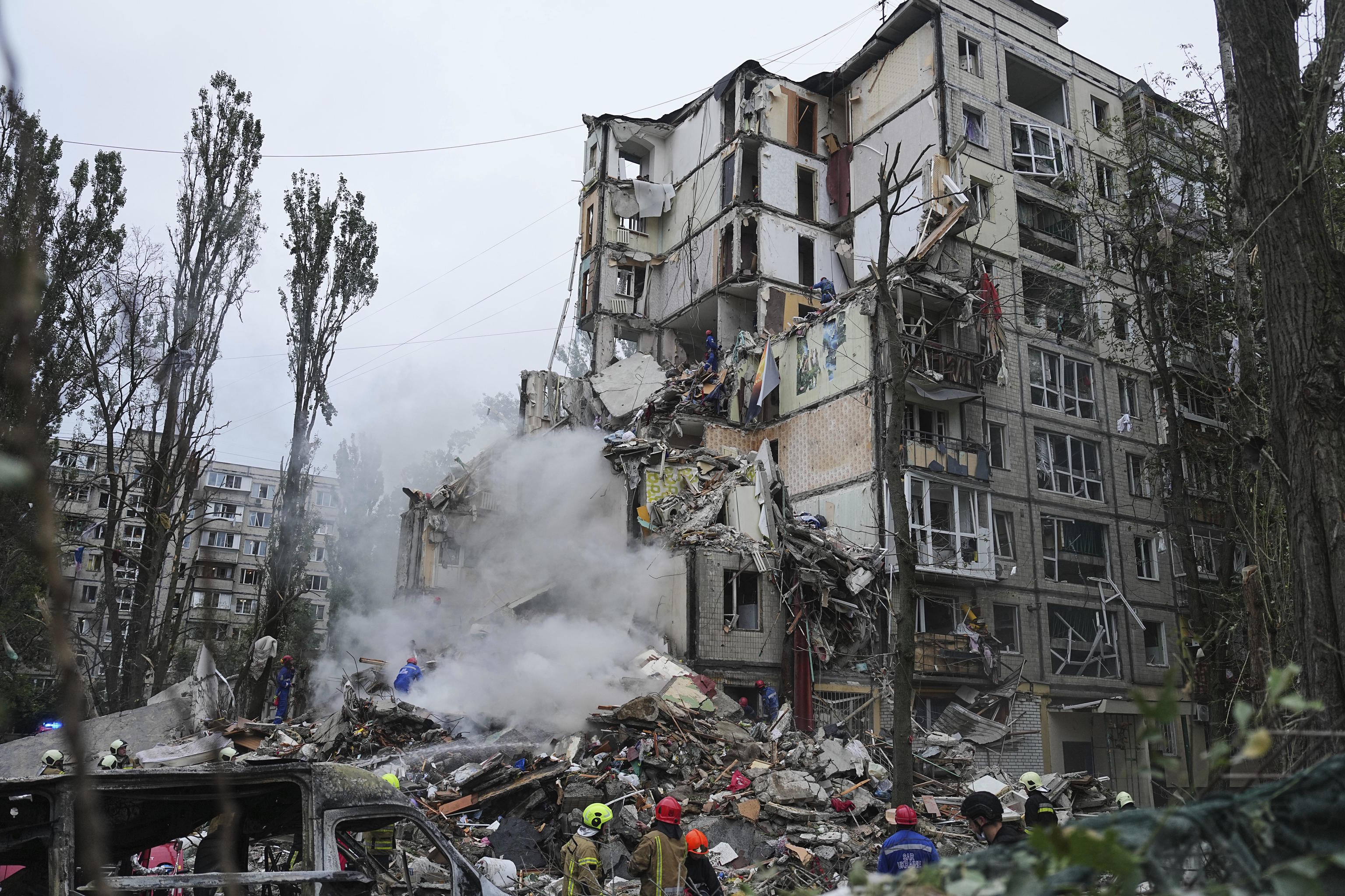 Rescuers at a destroyed building after a Russian missile attack in Kyiv.