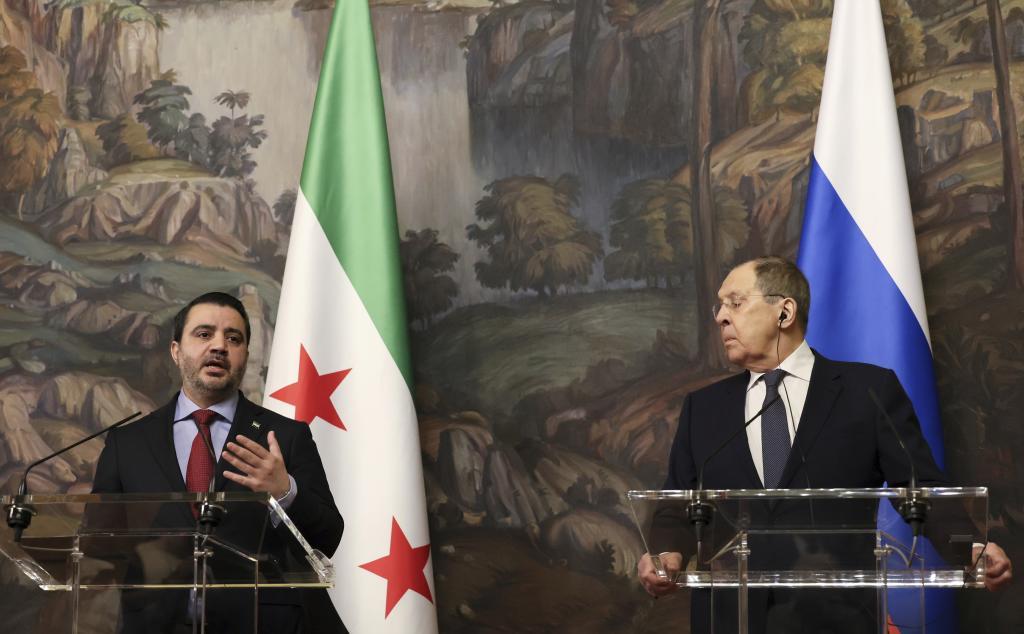 Sergey Lavrov, right, and Syrian Foreign Minister Asaad Hassan al-Shibani.