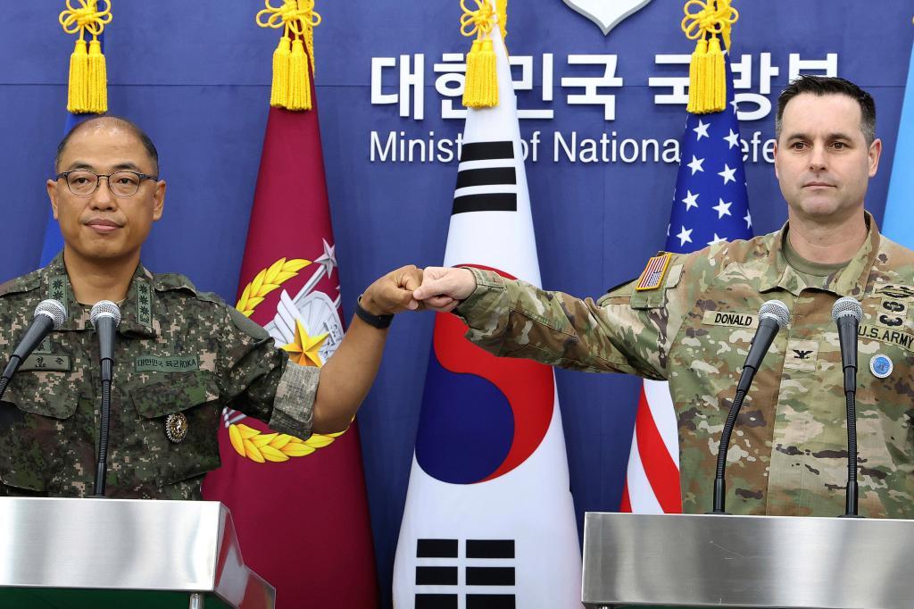 Col. Lee Sung-jun, left, public affairs director of South Korea's Joint Chiefs of Staff and Col. Ryan Donald