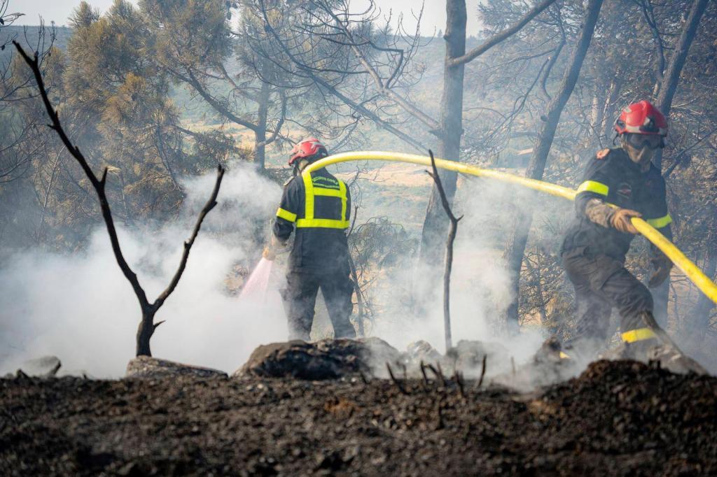 Firefighters battling wildfire.