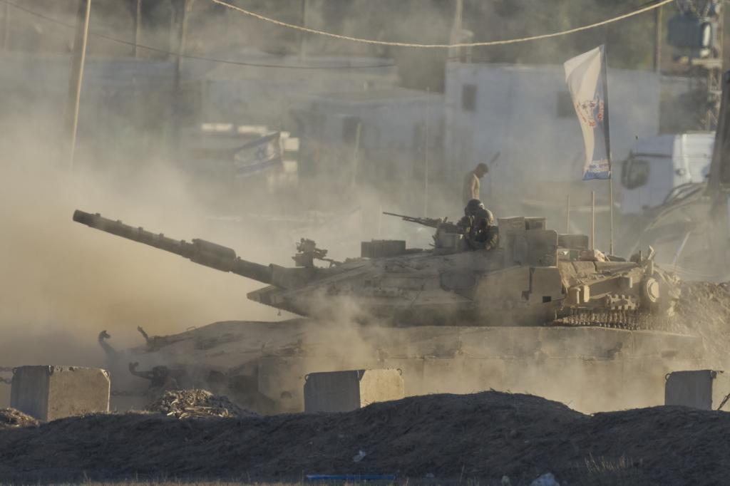An Israeli tank moves near the border of the Gaza Strip in southern Israel