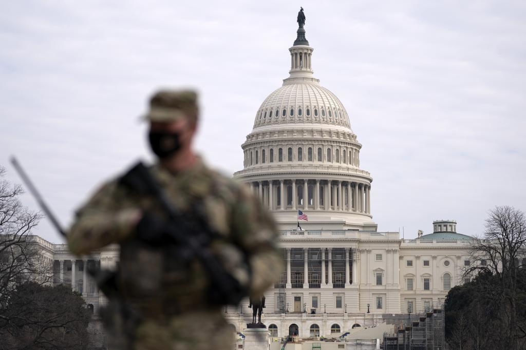 A member of the National Guard patrols the area outside of the U.S. Capitol in Washington