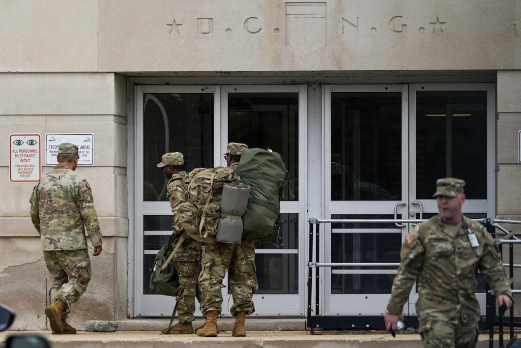 Members of the District of Columbia National Guard arrives at the District of Columbia National Guard Headquarters