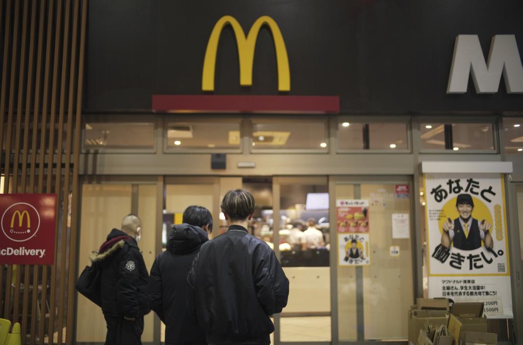 People stands outside a McDonald's store in Tokyo