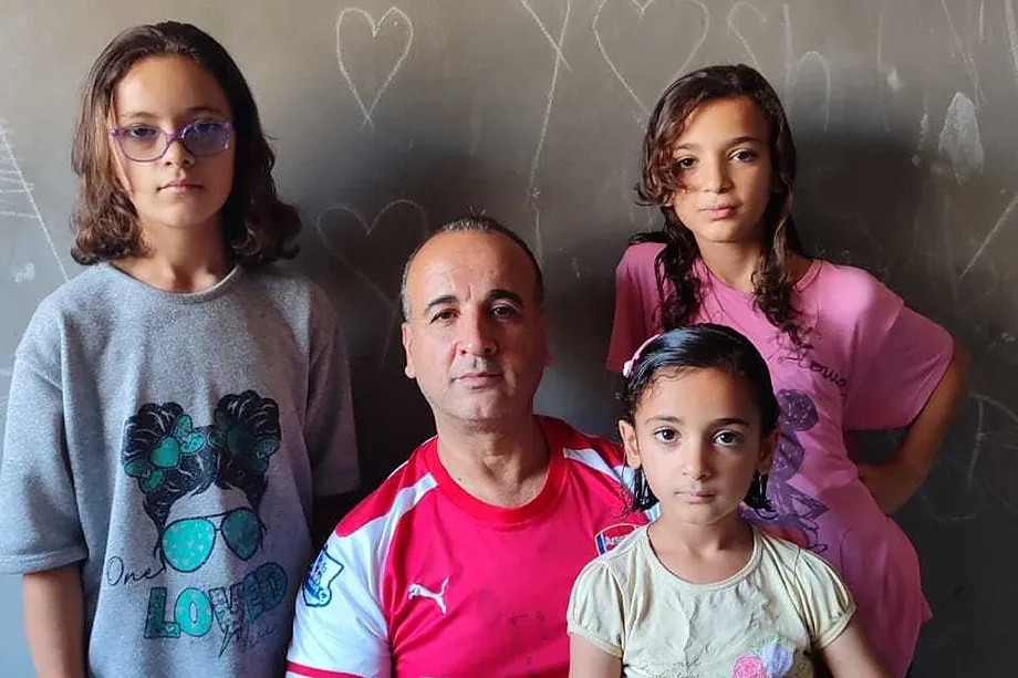 Dr. Refaat Alathamna with his daughters.