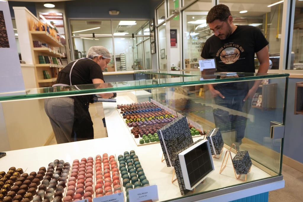 Giev Askari gets a box of bon bons for his wife at Exquisito Chocolates