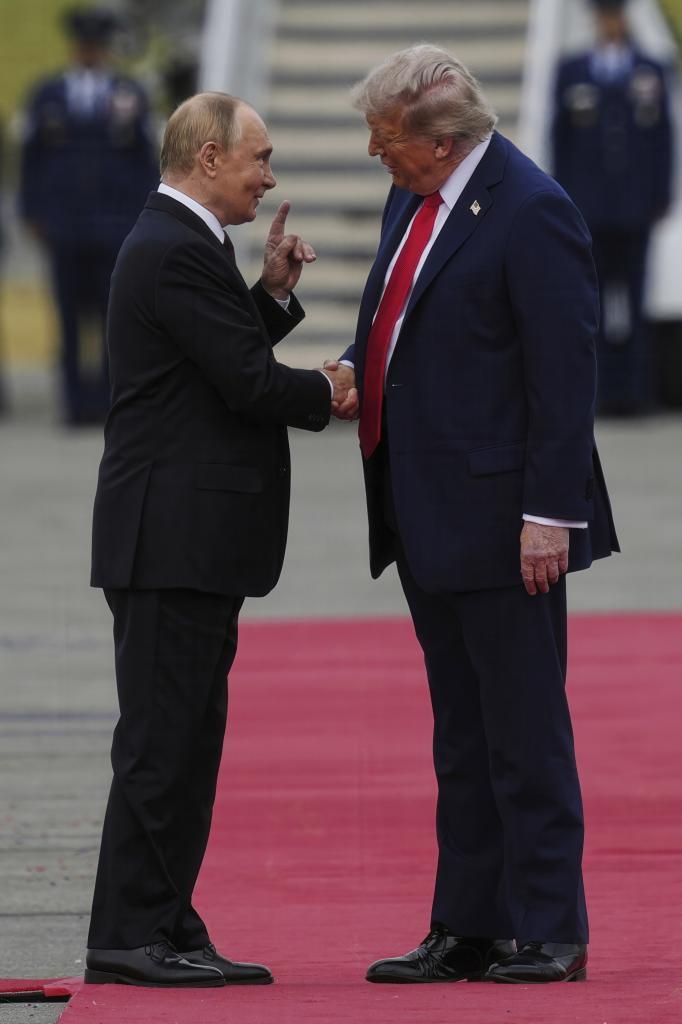 President Donald Trump greets Russia's President Vladimir Putin