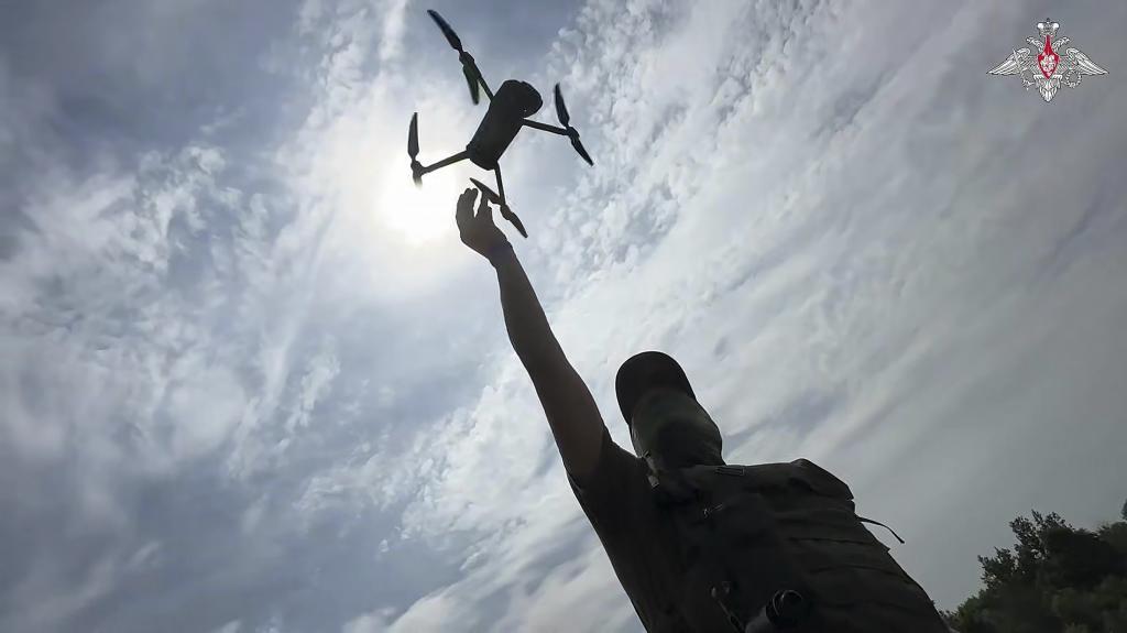 A soldier launches reconnaissance drone in an undisclosed location in Ukraine