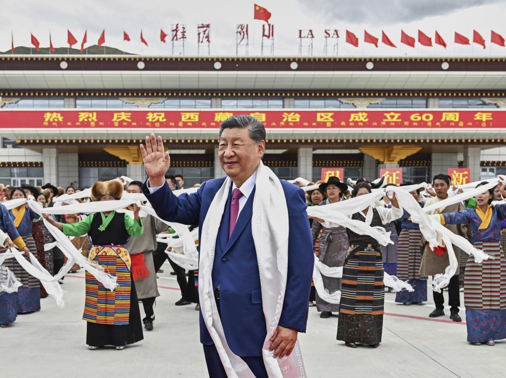 Chinese President Xi Jinping greets upon his arrival in Lhasa in the western Tibet Autonomous Region