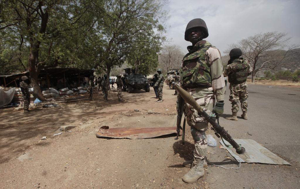 Nigerian soldiers man a checkpoint in Gwoza