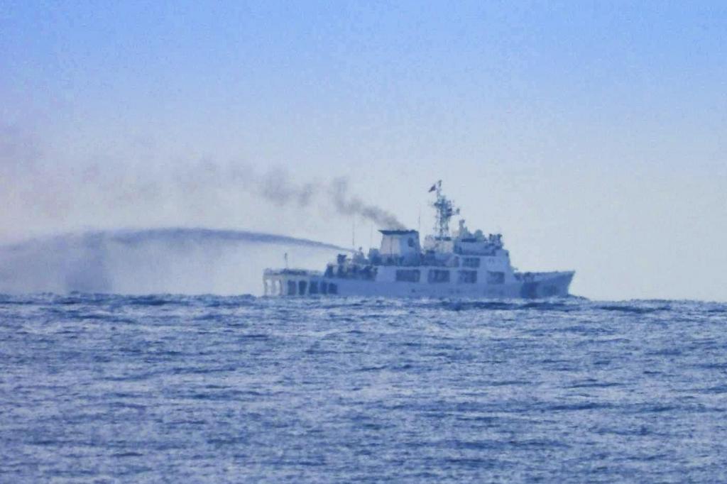 China Coast Guard Vessel conducts apparent water cannon drill close to long-grounded Philippine warship BRP Sierra Madre