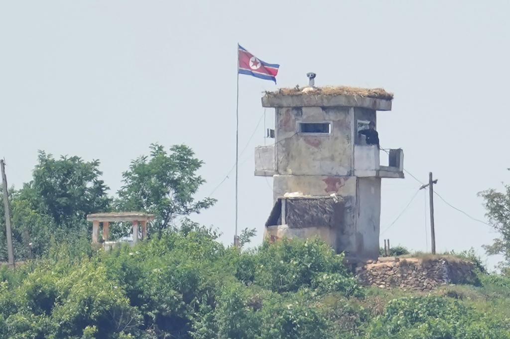A soldier stands at a North Korean military guard post
