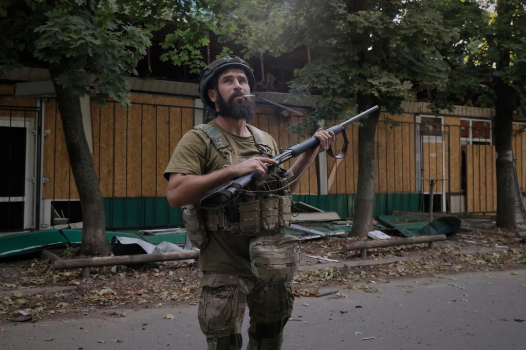A Ukrainian soldier gets ready to fire at Russian FPV drones