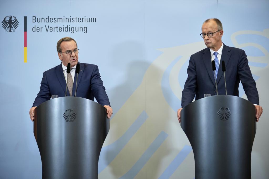 German Defense Minister Boris Pistorius, left, speaks during a joint press conference with German Chancellor Friedrich Merz,