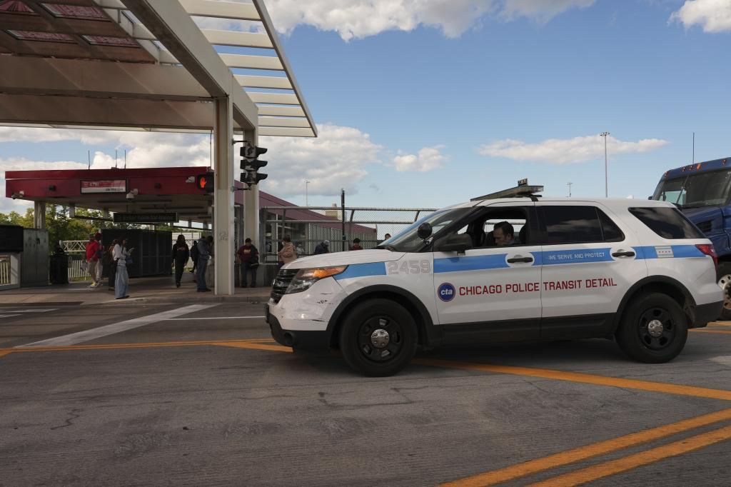 Chicago Police Transit Detail official parks outside a CTA station in Chicago