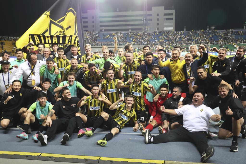 Kairat players celebrate after winning the Champions League playoff second leg soccer match between Kairat and Celtic