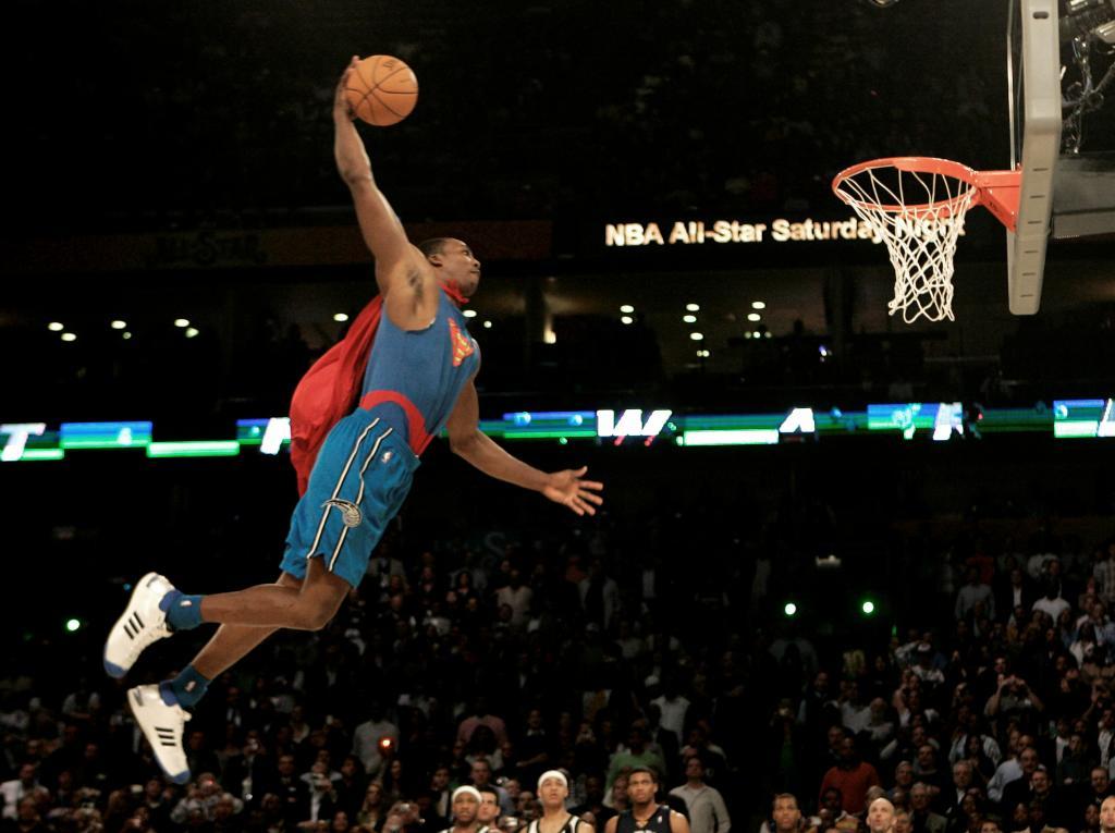 Wearing a Superman costume, Orlando Magic forward Dwight Howard