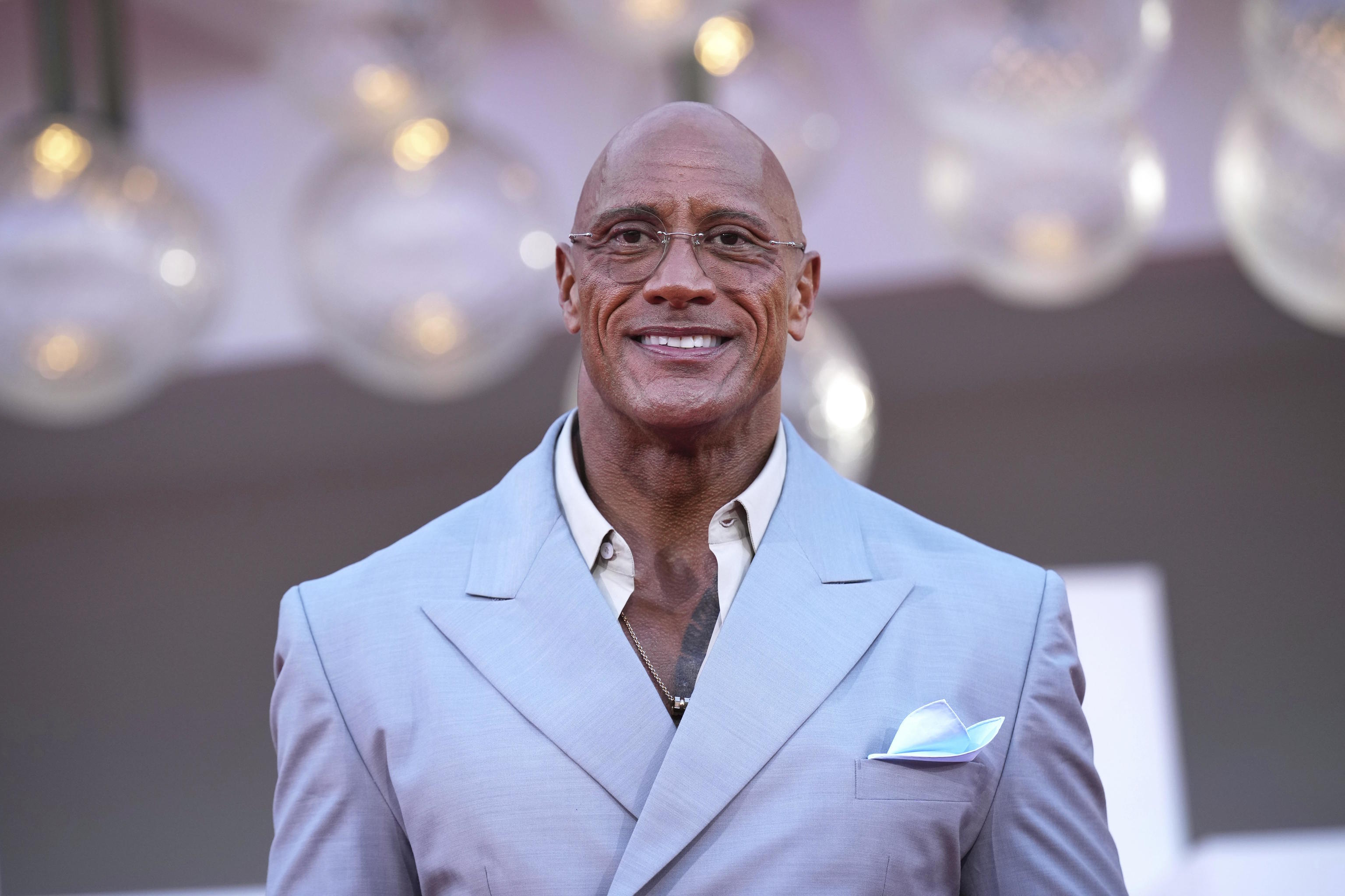 Dwayne Johnson poses for photographers in Venice.