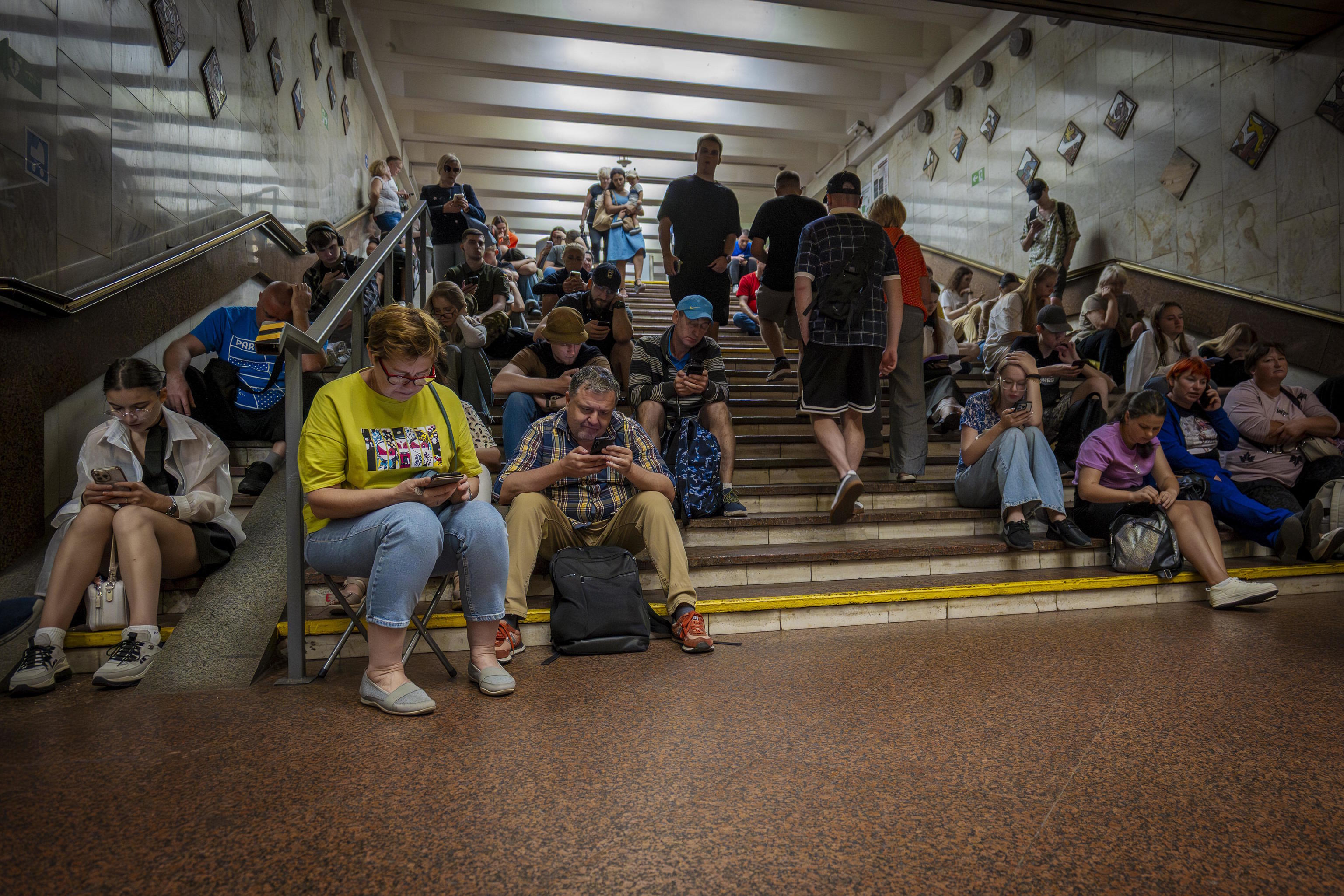 People rest in a metro station during a Russian attack in Kyiv, Ukraine.